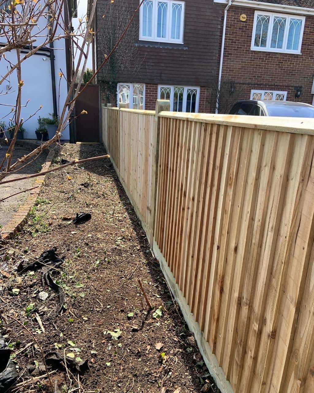 This is a photo of feather edge fencing installed in a residential property by Fast Fix Fencing Red Lodge