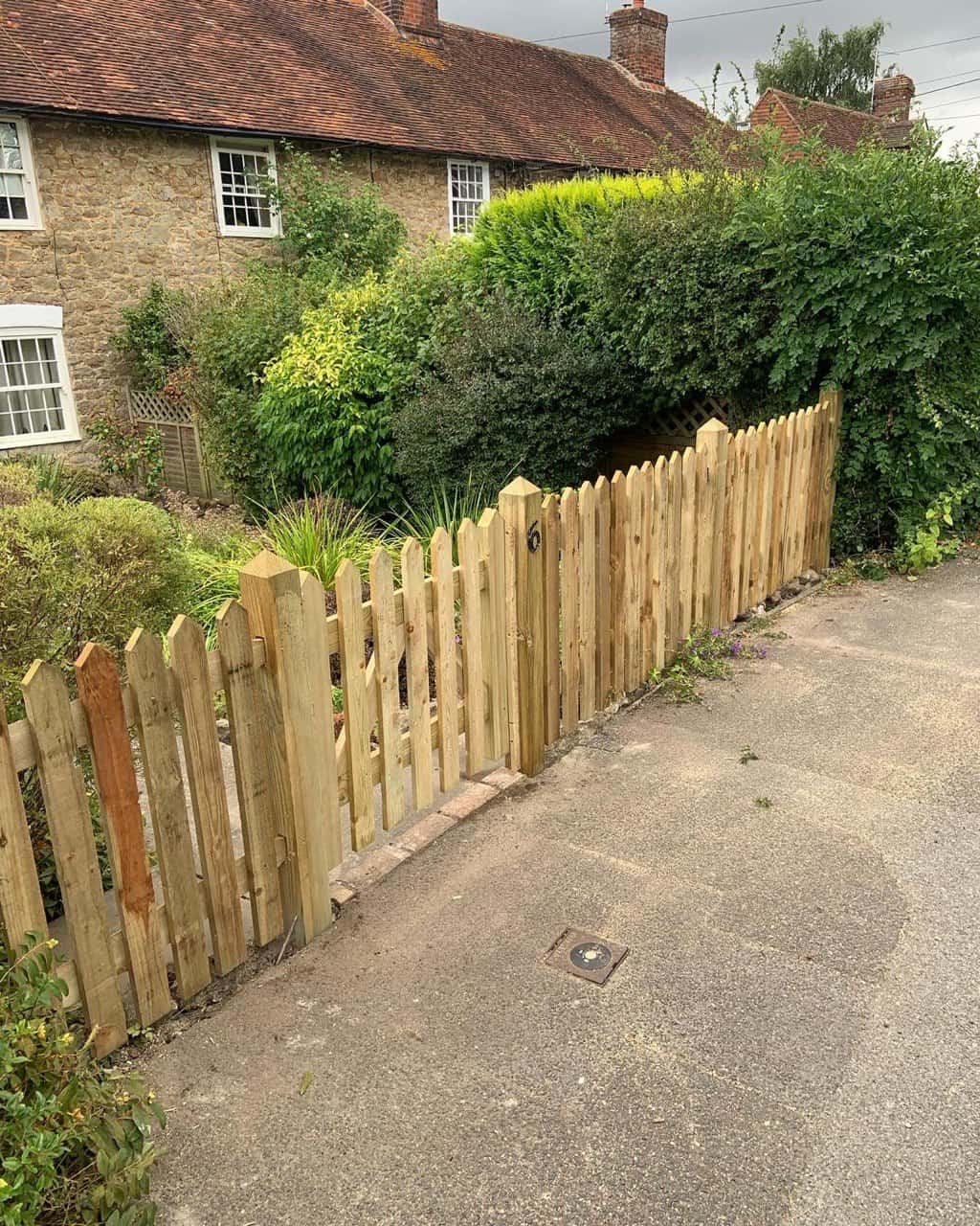 This is a photo of a picket fence and picket gate installed by Fast Fix Fencing Red Lodge