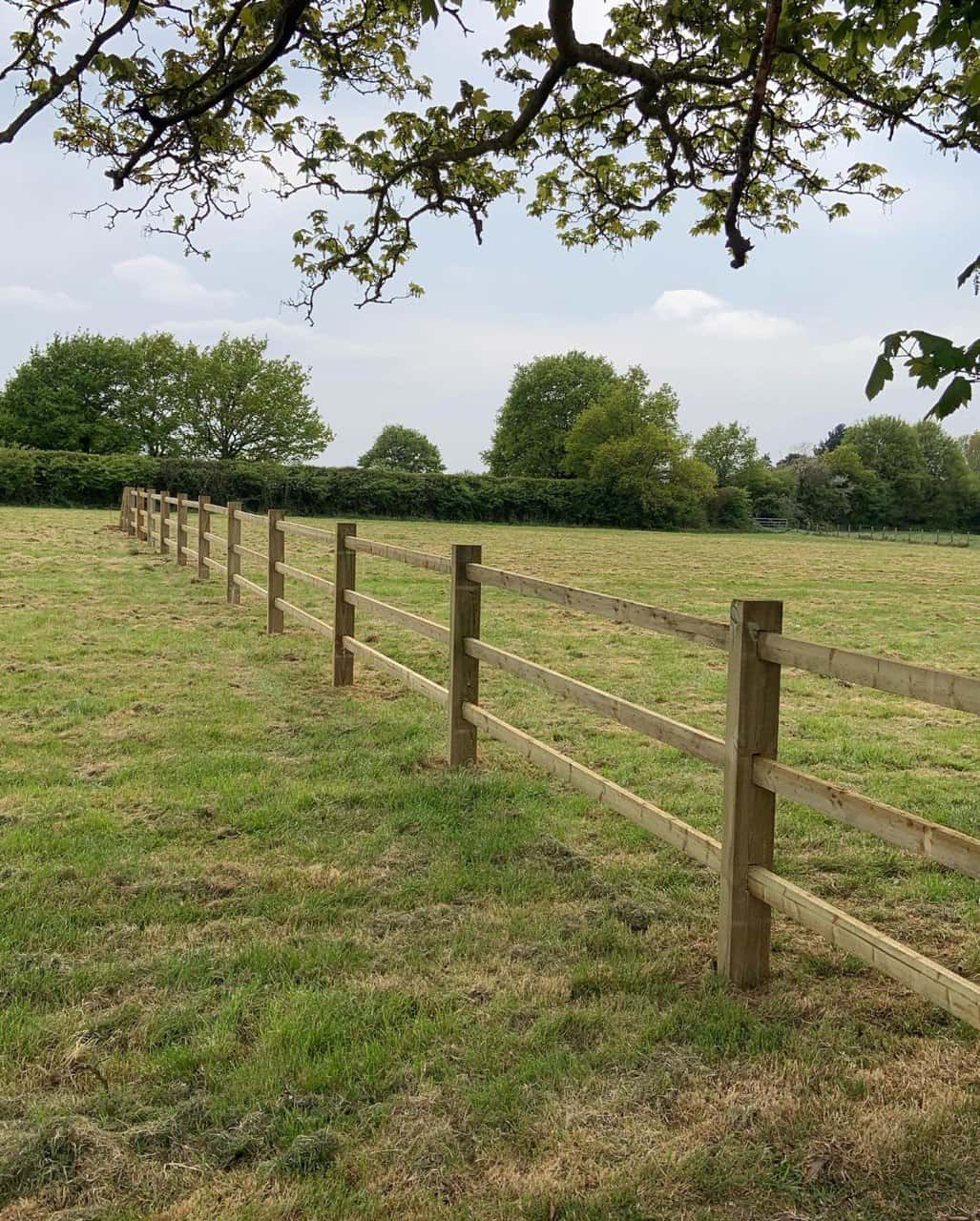 This is a photo of a post and rail fence installed in a field by Fast Fix Fencing Red Lodge